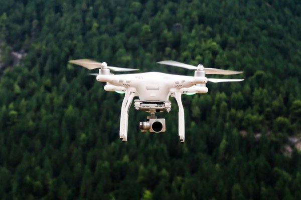How are AI-powered drones used in wildlife monitoring?